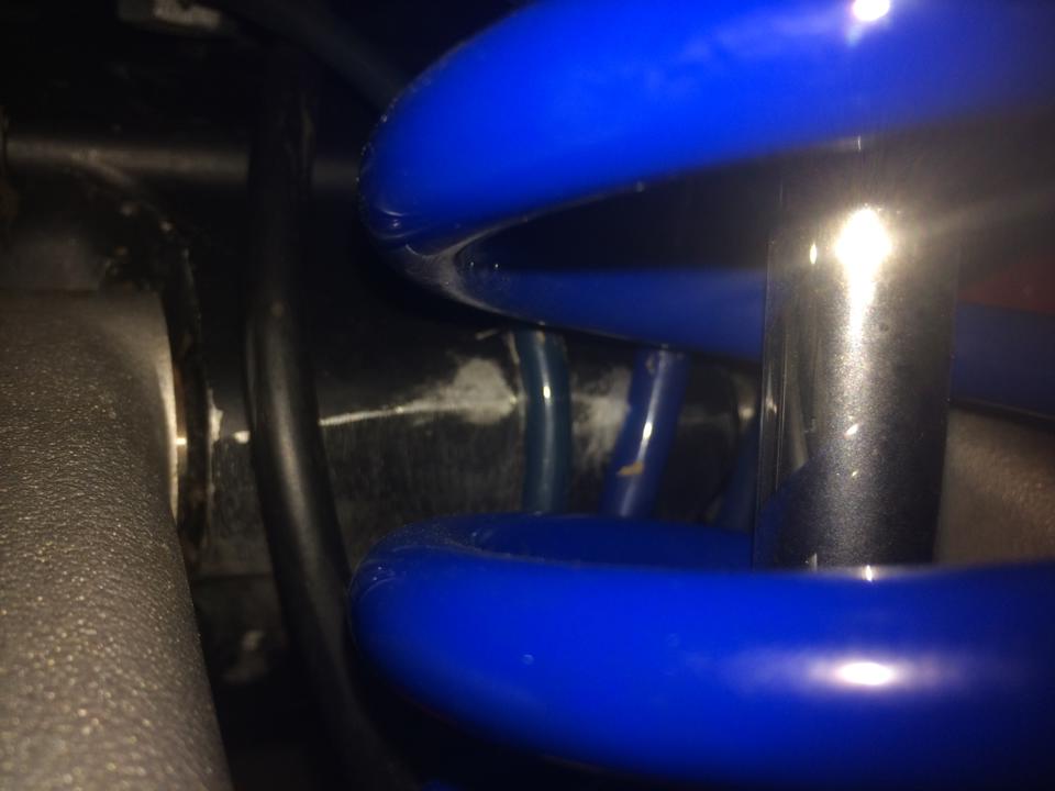 rear of the engine filed down a few mm so that the carb hoses are not pinched by the rear srping